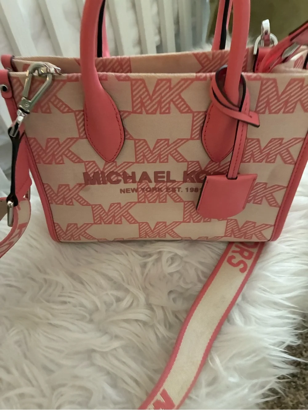 Michael Kors Mirella Small Logo Jacquard Crossbody Bag tea rose pink colorway.